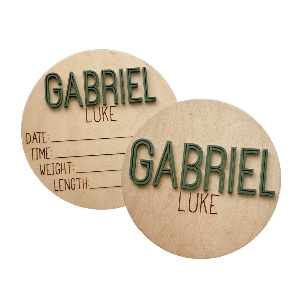 Green double-sided wooden sign with baby's name on both sides and stats on one