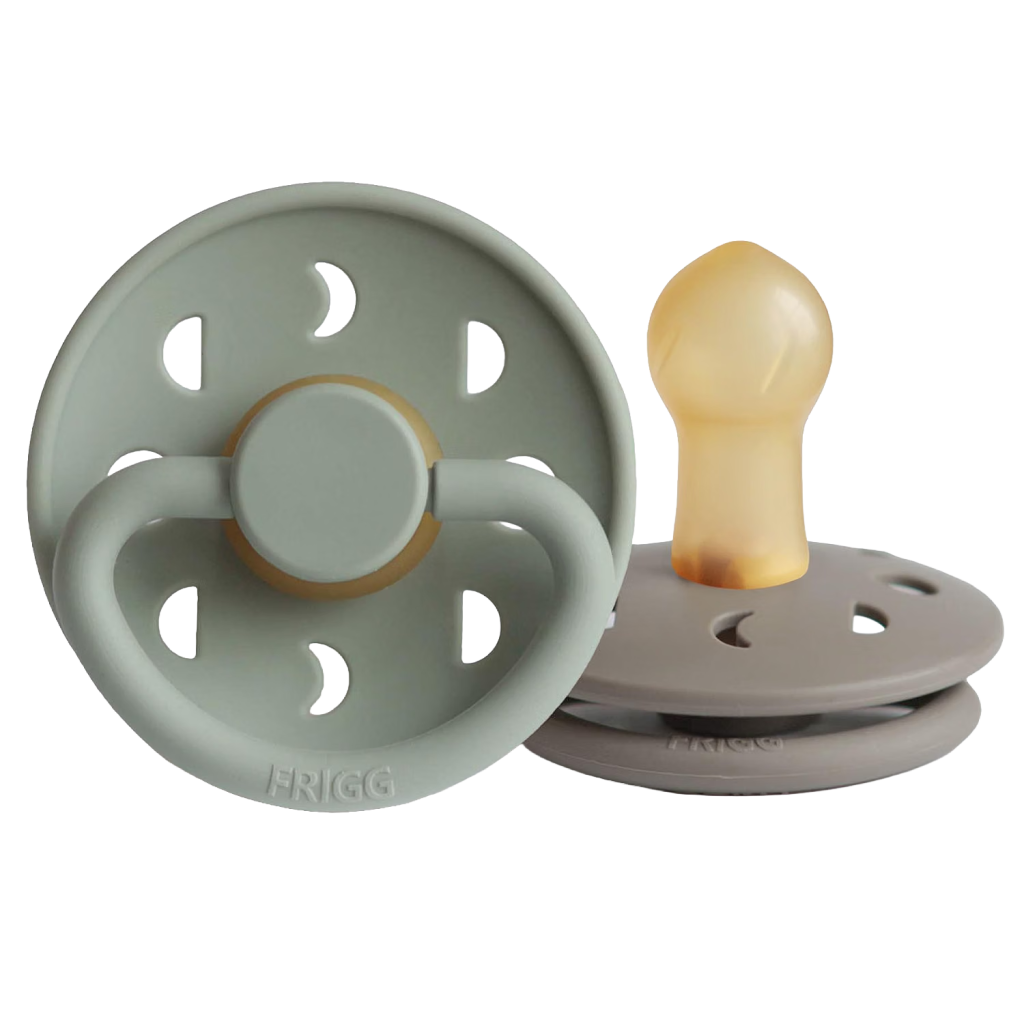 Bulb pacifiers in green and mushroom brown with moon phase cutouts on the shield